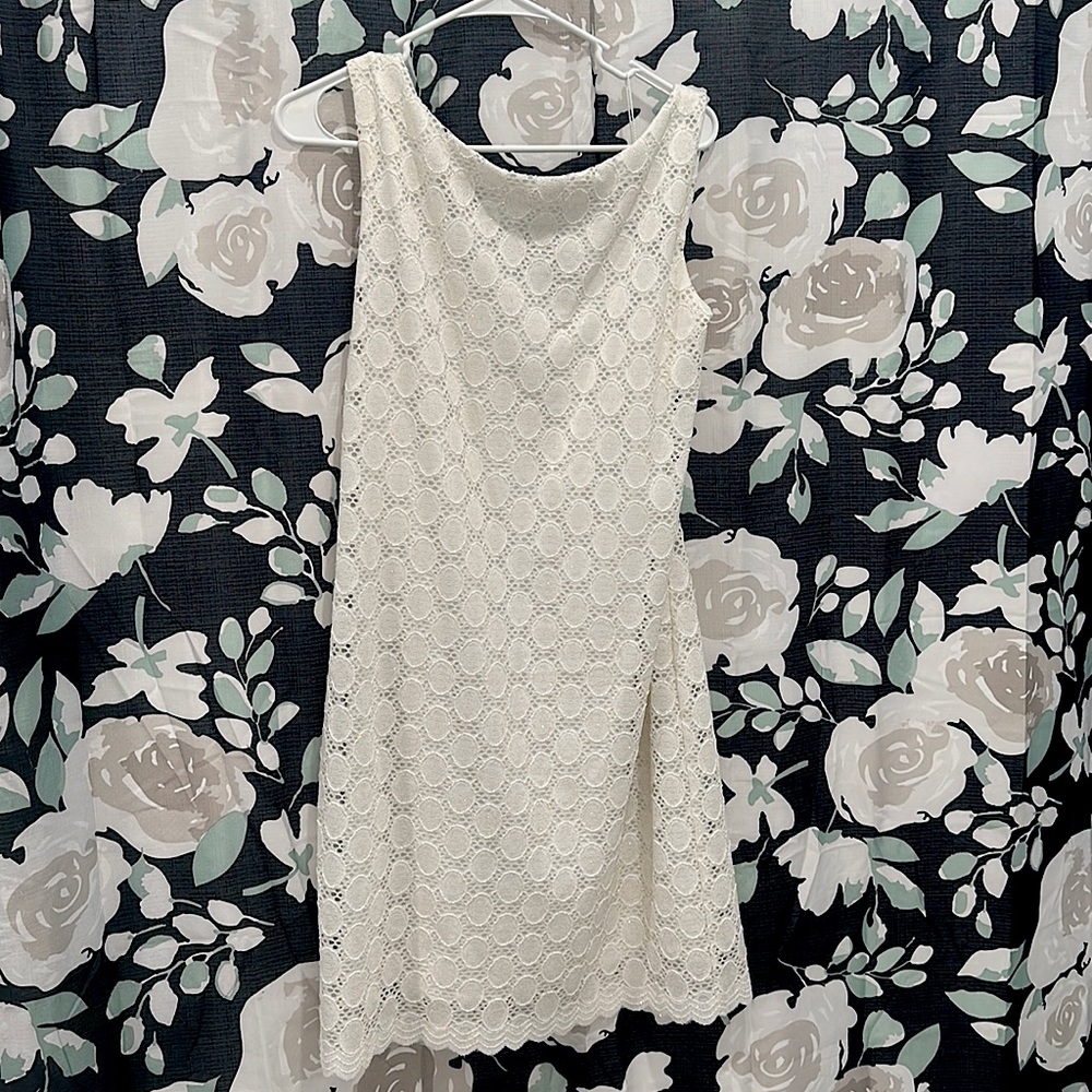 White lace like, gold zipper dress.